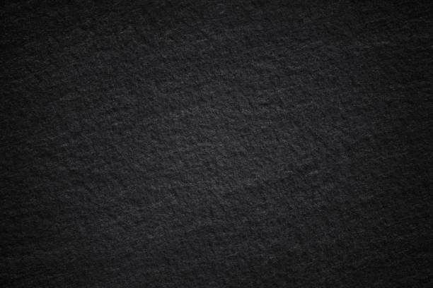 istock Dark grey black slate background or natural stone texture. 1060340290