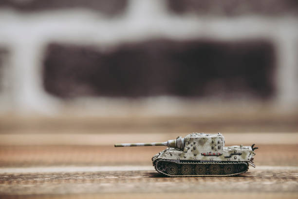 istock Brick background and toy tank 1060343304