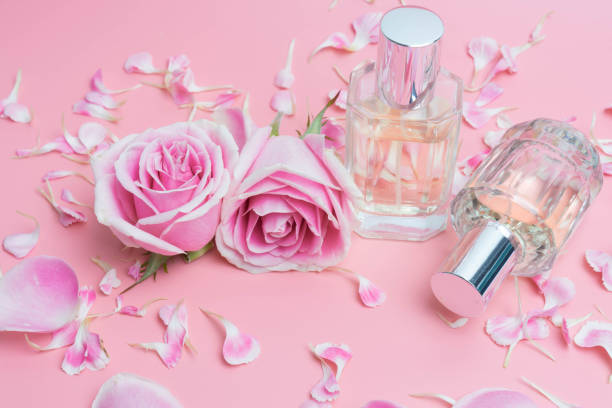 istock Beautiful perfume bottles on pink background 1060350332