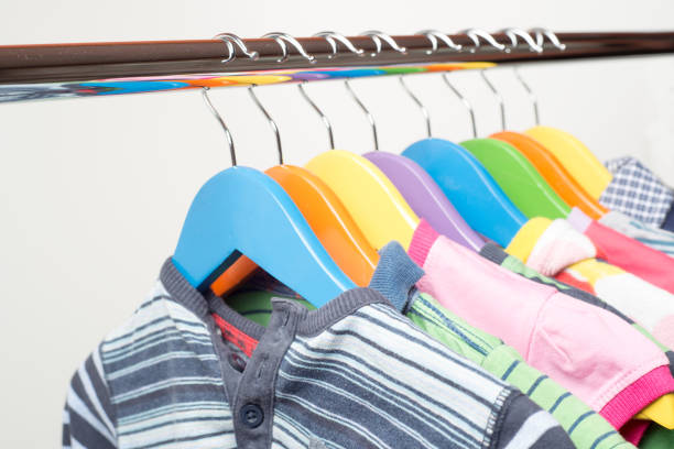 istock Hangers with colourful clothes isolated on white background 1060357584