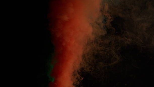istock Colorful Smoke on Dark Background 1060383656