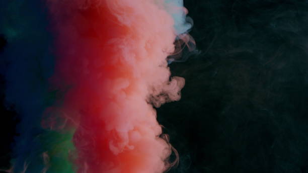 istock Colorful Smoke on Dark Background 1060383694