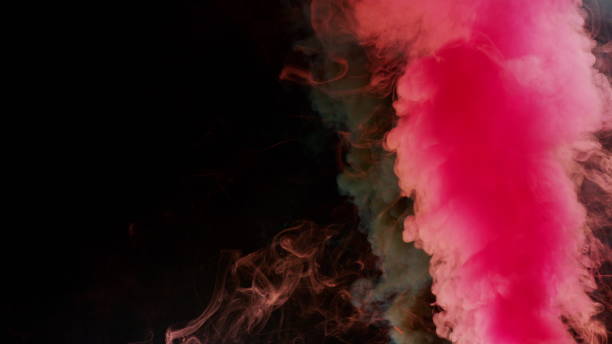 istock Colorful Smoke on Dark Background 1060383788
