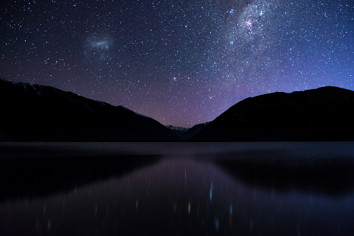 Amazing Starry night at Lake Rotoiti. Reflection of the Milky way and galaxy on the lake. Nelson Lake National Park, New Zealand. High ISO Photography.