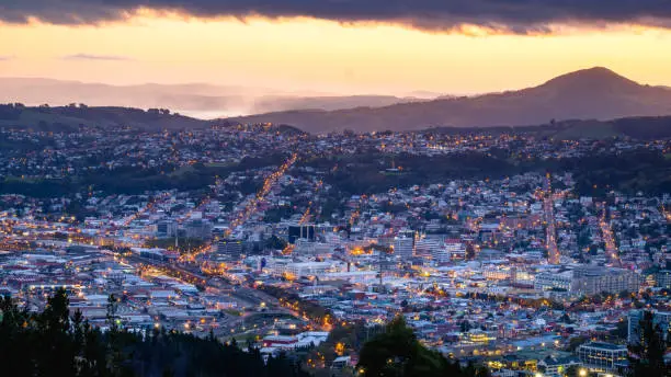 Photo of Beautiful cityscape after sunset. Nightlight. Dunedin, New Zealand.