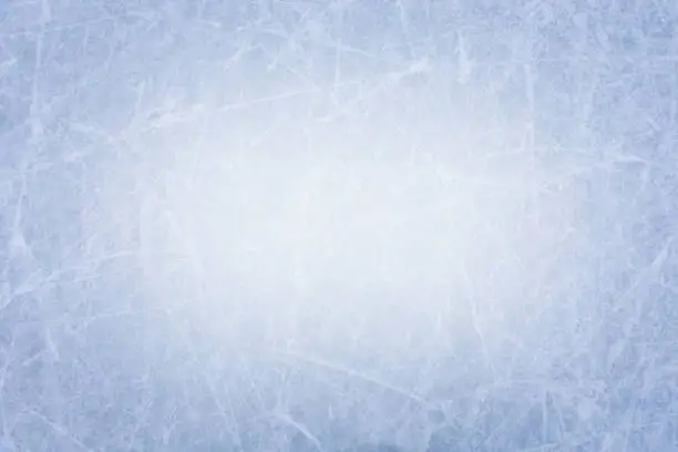 Photo of Ice rink surface texture background with scratches