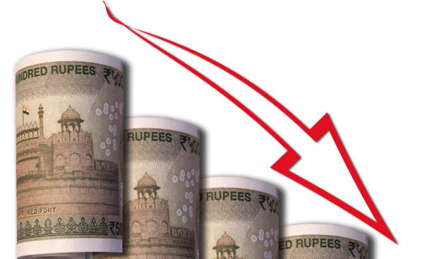 a money bill looking like a declining graph with an downward pointing arrow symbolizing economic relationships - indian falls imagens e fotografias de stock