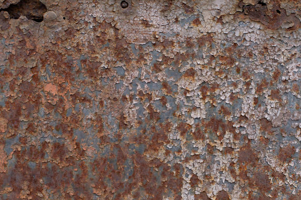 The texture of old rusty cracked painted metal surface stock photo