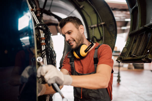 istock Smiling young man repairing airplane 1060400514