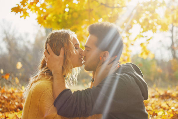 istock Young couple in love in autumn forest 1060401014