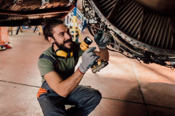istock Happy man repairing aircraft 1060401340