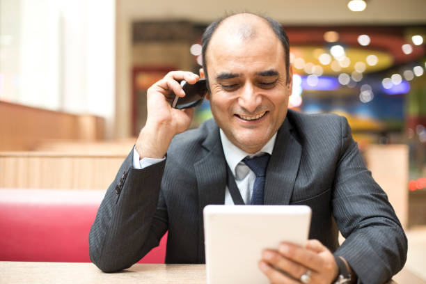 istock Businessman using digital tablet and phone 1060404590