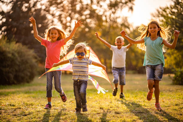 istock Excited children running in nature 1060406820