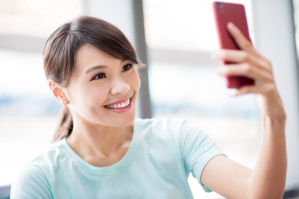 istock woman use phone selfie happily 1060407150