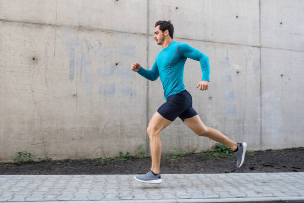 istock Young man running outdoors in morning 1060407286