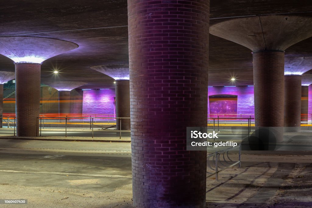 A violet illuminated underpass below an highway bridge in Copenhagen in Denmark - 2 Street Stock Photo