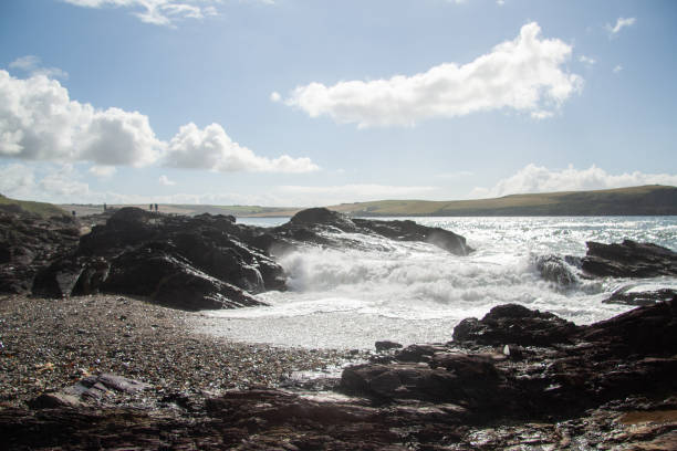 istock Waves crashing on the sandy beach with blue sky 1060409982