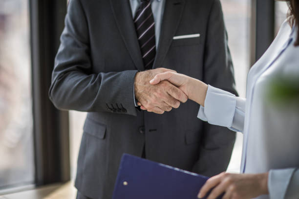 istock Unrecognizable business people shaking hands in the office. 1060410408