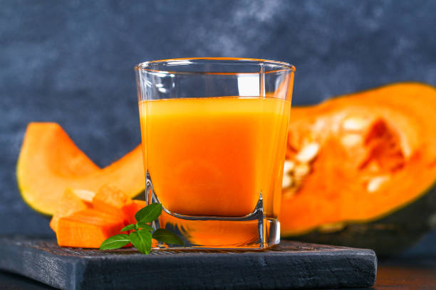 istock Pumpkin Smoothie Pumpkin juice on a dark table. Autumn drinks. 1060411892