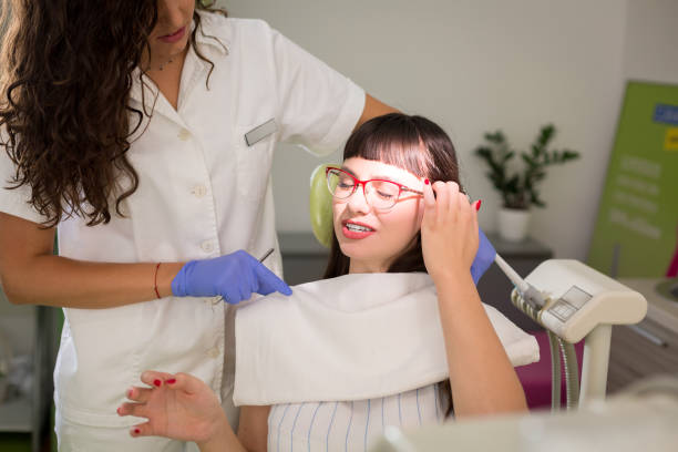 istock Woman having teeth examined at dentists 1060414328