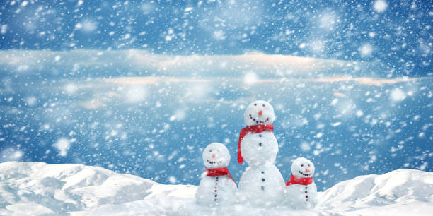 istock Group of snowmen on snow covered landscape during snowing 1060414494