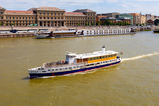 Budapest Hungary April 26 2018: Small cruise ships on Danube river at Budapest.