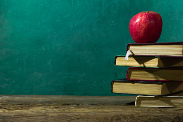 istock Old books on a wooden table. Beautiful background. 1060417586
