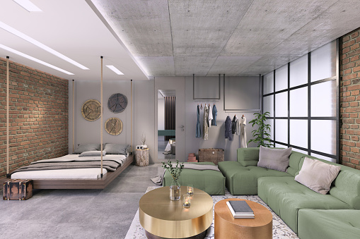 Modern interior, studio loft apartment with living room and bedroom in the same room. Clothes rack, bed hanging from the ceiling, large sofa, coffee table, brick wall. Lots of details, copy space background