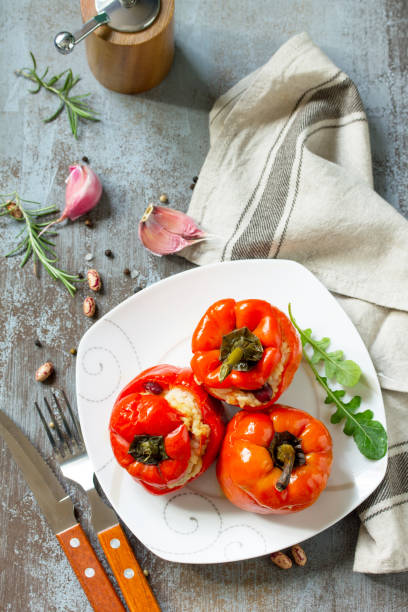 istock Stuffed Pepper with Rice, Tomatoes and Beans on a stone or concrete background. Vegetarian Healthy Food. 1060429390