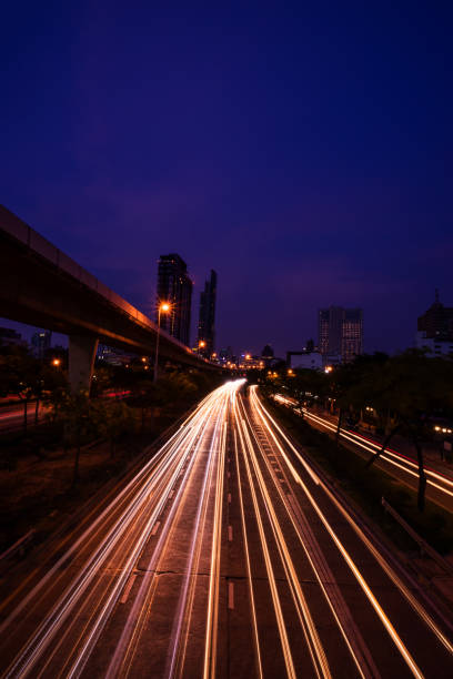 istock abstract light tail on twilight time in cityscape view - can use to display or montage on product 1060435332