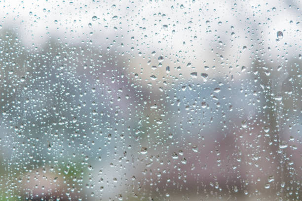 istock Rain drops on a window glass. Abstract background texture. Defocised image 1060438102
