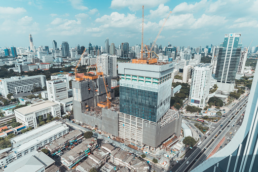 Bangkok, Thailand - Sep 6, 2018: Construction site of office building, shopping center, or community mall project in Bangkok, Thailand. Aerial top view cityscape on sunny day.