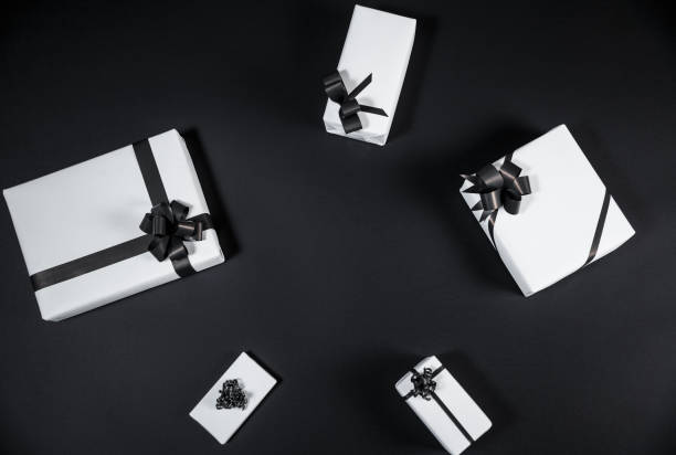 istock White gift box on a dark contrasted background, decorated with a textured bow, creating a romantic atmosphere. 1060445998
