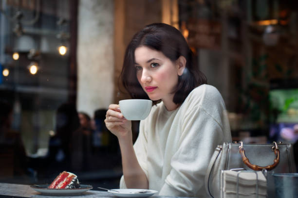 istock Woman enjoy coffee break in a coffee shop 1060447780