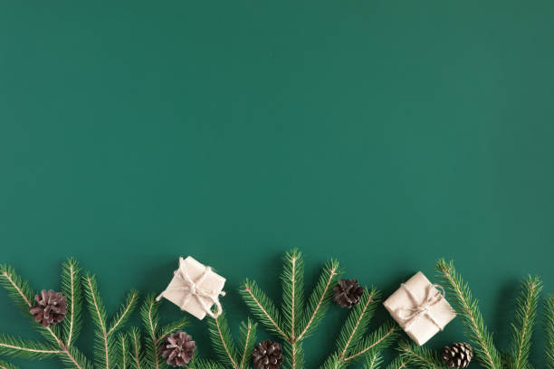 istock Christmas Present holiday boxes and spruce branches on vintage white background, top view. New year flat lay 1060451334