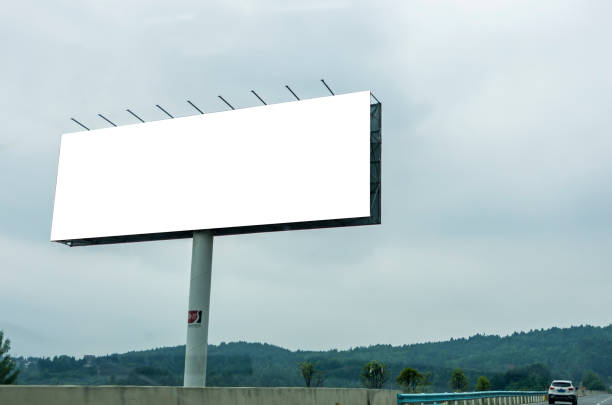 istock Blank billboard on blue sky background for new advertisement 1060451632