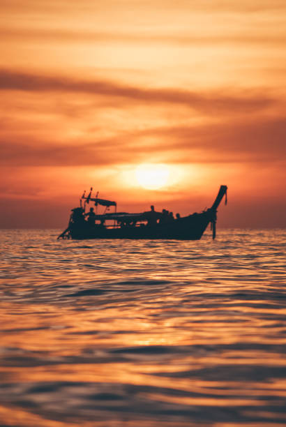 istock Thai Taxi Boat in a sunset 1060452128