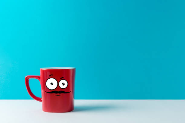 istock Red cup with mustache on white table over blue background. Coffee concept. 1060452138