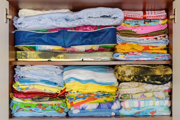 istock Colorful linens in old retro wardrobe 1060452356