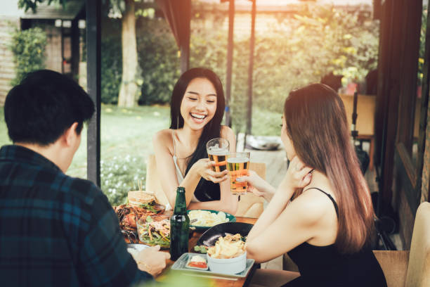 istock Teeneger asian friends clinking glasses while enjoying an evening meal in a restaurant. 1060464318