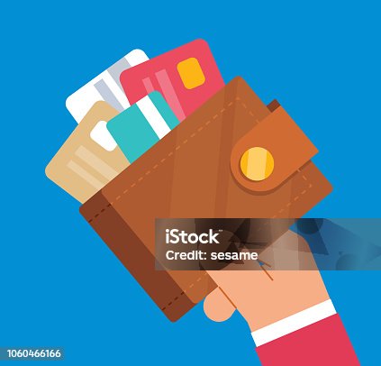 istock Businessman holding wallet full of credit cards 1060466166