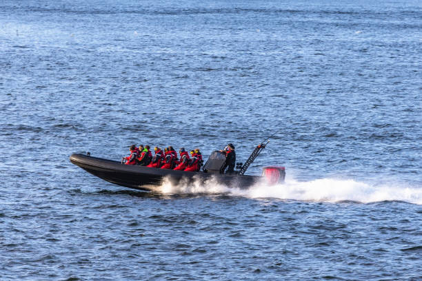 Tourists in speedboat sightseeing islands around Stockholm. Sweeden. Tourists in speedboat sightseeing islands around Stockholm. Sweeden. racing boat photos stock pictures, royalty-free photos & images