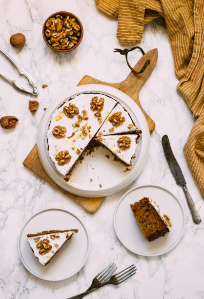 Carrot Cake with Cream Cheese Icing and walnut. Vegan and gluten free concept stock photo