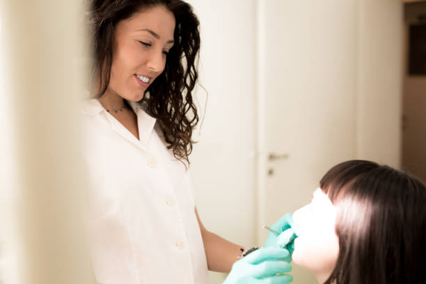 istock Woman having teeth examined at dentists 1060468720
