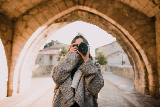 istock Woman taking a picture with a DSLR camera 1060468942