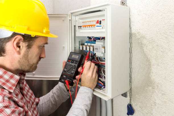 istock electrician at work measures the electric current 1060470230
