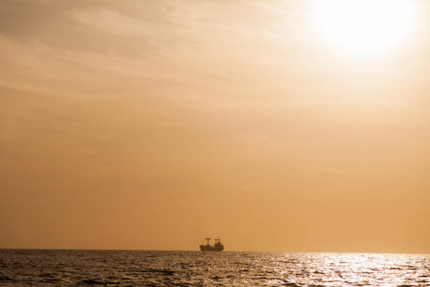 istock Sunset landscape ocean sea and ship on the horizon 1060470472