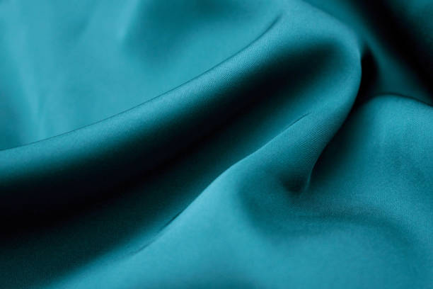 istock Silk Fabric Background, Blue Satin Cloth Waves, Abstract Flowing Waving Textile 1060471078