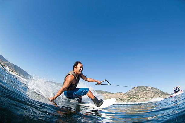 japanese man wakeboarding - water ski foto e immagini stock