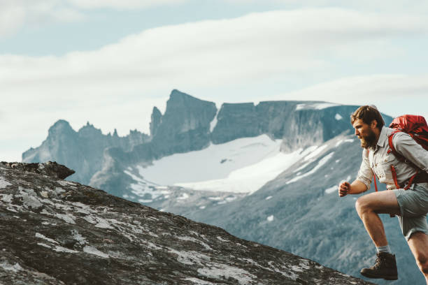 istock Active Man running in mountains with backpack Norway Travel hiking lifestyle concept active weekend summer vacations skyrunning sport 1060474076